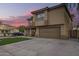 Two-story home showcasing an attractive facade, manicured lawn, and a welcoming covered porch at 3473 E Wyatt Way, Gilbert, AZ 85297