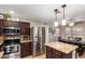 Modern kitchen featuring stainless steel appliances, granite countertops, and a functional island, perfect for Gathering cooking at 3473 E Wyatt Way, Gilbert, AZ 85297