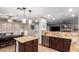 Well-lit kitchen with granite countertops, stainless steel appliances, and a view into the adjacent dining area at 3473 E Wyatt Way, Gilbert, AZ 85297
