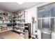 Spacious pantry with organized shelving and a variety of food items; tile flooring and natural light complete the space at 3473 E Wyatt Way, Gilbert, AZ 85297