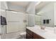 Bathroom featuring a shower-tub combo with a dark-wood vanity and white countertops at 3943 E Ficus Way, Gilbert, AZ 85298