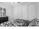 Bedroom with a ceiling fan, carpet, closet with sliding doors, and shutters on the window at 3943 E Ficus Way, Gilbert, AZ 85298