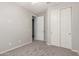 Carpeted bedroom with neutral walls, ceiling fan and closet at 3943 E Ficus Way, Gilbert, AZ 85298