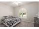 Bedroom with ceiling fan, shuttered window and dresser at 3943 E Ficus Way, Gilbert, AZ 85298