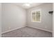 Bedroom with neutral walls, carpet and shuttered window at 3943 E Ficus Way, Gilbert, AZ 85298
