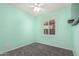 This cozy bedroom features a ceiling fan and a window with shutter shades at 3943 E Ficus Way, Gilbert, AZ 85298