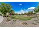 Expansive community park offers lush green space with mature trees, walking paths, and scenic landscaping for residents to enjoy at 3943 E Ficus Way, Gilbert, AZ 85298