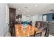 Dining room and view of the open floorplan with stylish kitchen and living room at 3943 E Ficus Way, Gilbert, AZ 85298
