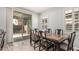 Bright dining room featuring sliding glass doors, a view to the yard, and a traditional wood table at 3943 E Ficus Way, Gilbert, AZ 85298