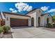 Inviting single-Gathering home featuring a two-car garage and low maintenance landscaping at 3943 E Ficus Way, Gilbert, AZ 85298