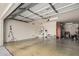 Spacious garage showcasing ample storage space, epoxy flooring, and modern lighting at 3943 E Ficus Way, Gilbert, AZ 85298