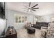 Bright living room with large windows and tile floors, offering ample natural light at 3943 E Ficus Way, Gilbert, AZ 85298
