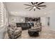Open-concept living area with tile floors, ceiling fan and view of the kitchen at 3943 E Ficus Way, Gilbert, AZ 85298