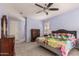Bright main bedroom boasting a ceiling fan, comfortable furnishings, and ample natural light at 3943 E Ficus Way, Gilbert, AZ 85298
