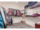 Walk-in closet with built-in shelving and ample storage space for clothes and accessories at 3943 E Ficus Way, Gilbert, AZ 85298