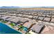 An aerial view featuring a waterfront community with cozy homes and neat landscaping at 40835 W Agave Rd, Maricopa, AZ 85138