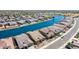 Stunning aerial view of a lakeside community with beautifully landscaped homes and serene waterways at 40835 W Agave Rd, Maricopa, AZ 85138