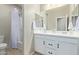 Well-maintained bathroom with a double sink vanity and shower featuring modern fixtures and a clean, inviting ambiance at 40835 W Agave Rd, Maricopa, AZ 85138
