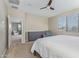 Bedroom features a ceiling fan, neutral walls, and a queen bed at 40835 W Agave Rd, Maricopa, AZ 85138