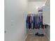 Walk-in closet with ample storage space for clothes, shoes, and accessories, ensuring organization and easy access at 40835 W Agave Rd, Maricopa, AZ 85138