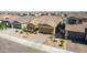 Aerial view of a charming single-Gathering home with a well-manicured lawn and a two-car garage at 40835 W Agave Rd, Maricopa, AZ 85138