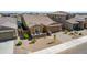Aerial view of a well-maintained single-Gathering home with a neat front yard and two-car garage at 40835 W Agave Rd, Maricopa, AZ 85138