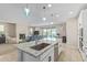 Open kitchen featuring a granite countertop island, stainless steel appliances, and pendant lighting at 40835 W Agave Rd, Maricopa, AZ 85138