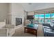 Comfortable living room with fireplace and sliding glass doors to the backyard at 40835 W Agave Rd, Maricopa, AZ 85138