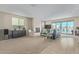 Spacious living room featuring neutral color palette, fireplace, and backyard access at 40835 W Agave Rd, Maricopa, AZ 85138