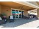 Outdoor patio with comfortable seating and a fire pit, creating an ideal space for relaxation and socializing with friends and Gathering at 40835 W Agave Rd, Maricopa, AZ 85138