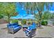 Serene backyard retreat featuring a cozy seating area with comfortable cushions and a beautifully paved patio space at 4306 W Summerside Rd, Laveen, AZ 85339