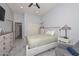 Neutral-toned bedroom featuring grey-washed furniture and tile floors at 4306 W Summerside Rd, Laveen, AZ 85339