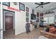 Bonus room featuring armchairs, sports memorabilia, and a ceiling fan at 4306 W Summerside Rd, Laveen, AZ 85339