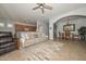 Spacious living room featuring tiled flooring, open access to the kitchen, and dining area at 4306 W Summerside Rd, Laveen, AZ 85339