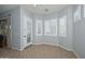 Cozy living room with door to outside and plantation shutters at 4306 W Summerside Rd, Laveen, AZ 85339