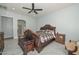 Spacious main bedroom features a ceiling fan, decorative furniture, and tiled floor at 4306 W Summerside Rd, Laveen, AZ 85339