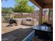 Stylish outdoor kitchen boasts a built-in grill and ample counter space for entertaining at 4306 W Summerside Rd, Laveen, AZ 85339