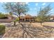 Tan home featuring desert landscaping and a covered patio, perfect for enjoying the outdoors at 4722 E Casey Ln, Cave Creek, AZ 85331
