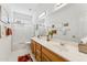 Bright bathroom with double sink vanity, a large mirror, and a shower and tub at 4722 E Casey Ln, Cave Creek, AZ 85331