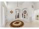 Bright foyer with high ceilings, arched doorways, decorative niches, and neutral tile floors at 4722 E Casey Ln, Cave Creek, AZ 85331
