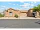 Exterior view of the house showing the garage, yard, and desert landscaping at 4722 E Casey Ln, Cave Creek, AZ 85331