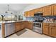 Functional kitchen featuring stainless appliances, stylish backsplash, and bright overhead lighting at 4722 E Casey Ln, Cave Creek, AZ 85331