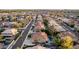 Sweeping aerial capture of a residential area displaying varied home designs, manicured lawns, and organized streets at 4812 S Windstream Pl, Chandler, AZ 85249