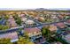 Elevated aerial view of a residential area highlighting a pool and patio, mature landscaping and a covered balcony at 4812 S Windstream Pl, Chandler, AZ 85249