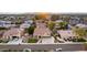 An aerial view of a suburban community featuring lush landscaping and mature trees at 4812 S Windstream Pl, Chandler, AZ 85249
