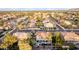 Expansive aerial view of a neighborhood showcasing well-maintained homes, mature trees, and wide streets at 4812 S Windstream Pl, Chandler, AZ 85249