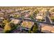 Panoramic aerial shot of a residential area, featuring neatly arranged houses, manicured lawns, and community landscaping at 4812 S Windstream Pl, Chandler, AZ 85249