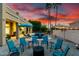Backyard with covered patio, inviting pool area, firepit, and desert landscaping for relaxing at 4812 S Windstream Pl, Chandler, AZ 85249