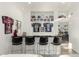 Stylish bar area with seating and sports memorabilia on display at 4812 S Windstream Pl, Chandler, AZ 85249