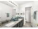 Bathroom with double sinks, sleek countertops, and a neutral color palette for a modern feel at 4812 S Windstream Pl, Chandler, AZ 85249